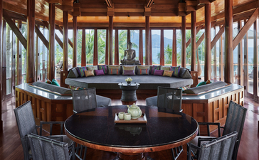 Seven-bedroom villa terrace at Amanpuri with wooden pavilion overlooking gardens.