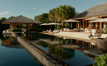 Villa pool at Amanyara, Turks and Caicos, with calm waters reflecting the surrounding architecture and tropical landscape.