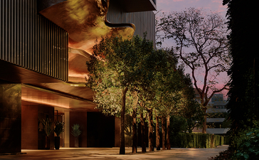 Aman Nai Lert Bangkok exterior at dusk, featuring illuminated architectural elements and landscaped greenery.