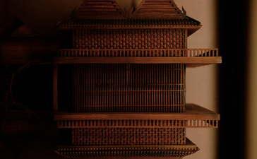 Architectural detail of a traditional Thai-style building at Aman Nai Lert Bangkok, reflected in still water.