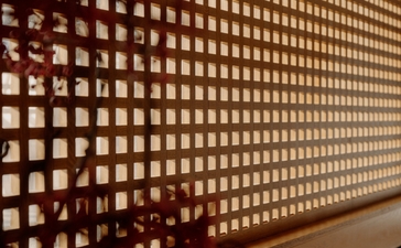 Entrance wall of small illuminated alcoves at Aman Le Mélézin, France.