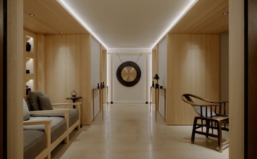 Spa corridor at Aman Le Mélézin resort with minimalist design, soft lighting, and warm wooden accents.