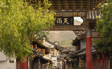 Covered passageway in Lijiang Old Town with traditional Chinese architecture and lantern, Amandayan.
