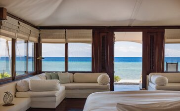 Ocean-front tent interior with panoramic sea views at Amanwana, Indonesia.