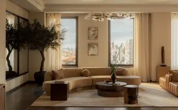 Ampia zona living della penthouse con tre camere da letto presso Aman New York, con vetrate affacciate sulla città e arredi minimalisti.