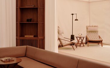 Grand Tented Pool Pavilion at Aman-i-Khas with modern furnishings and warm neutral tones.