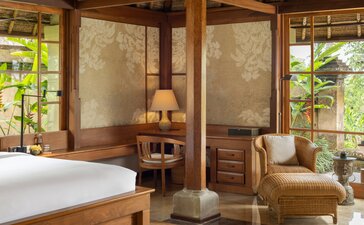 Garden Pavilion bedroom at Amandari, Indonesia, with wooden furnishings and garden views.
