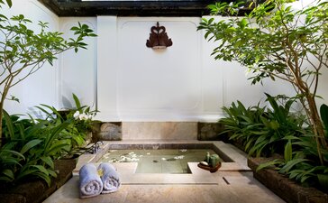 Sunken plunge pool surrounded by lush greenery at Amandari, Indonesia.