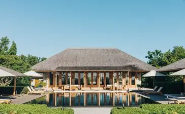 Four-bedroom beach sala at Amanyara with thatched roof and open-sided timber pavilion, Turks and Caicos.