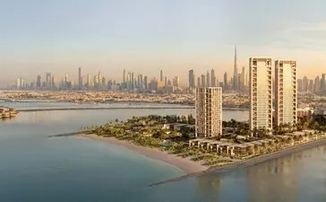 Aman Residences Dubai exterior overlooking the Arabian Gulf coastline at sunset.