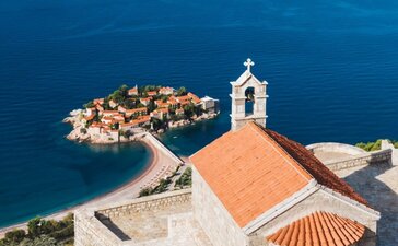 St. Sava Church with Aman Sveti Stefan island village below, Montenegro's Adriatic coast.