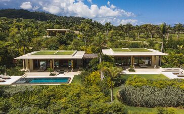 Amanera casita with infinity pool and tropical gardens overlooking Dominican Republic landscape.