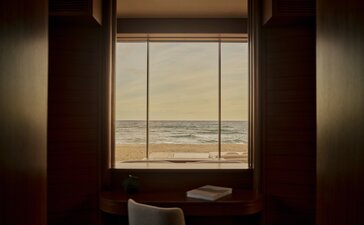 Beachfront casita at Amanvari with ocean view through window.