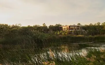 Elevated casita at Amanvari overlooking lush vegetation and waterways in Mexico.