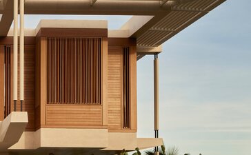 Horizon Casita at Amanvari with wooden façade and cantilevered shade structure overlooking Mexican landscape.