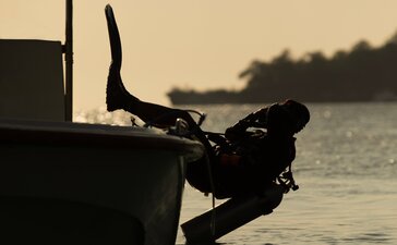Diver preparing to enter the water from the Aman XVII boat at Amanwana, Indonesia.