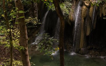 Swimming at Barry's Fall Waterfall, Amanwana, Indonesia.