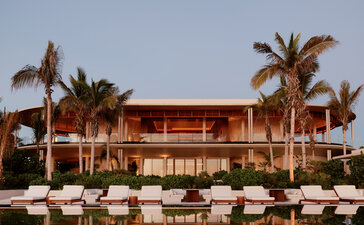 Casa Grande at Amanvari reflected in still water at dusk, Mexico.