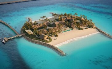 Double Beach Island Residence at Amanolu surrounded by turquoise waters and white sand.