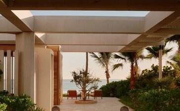 Beachfront casita arrival at Amanvari, Mexico, with covered terrace and tropical plants.