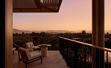 Casita terrace at dusk overlooking Mexican landscape at Amanvari, with chair and warm sunset sky.