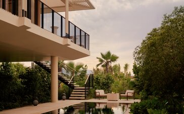 Casita terrace at Amanvari overlooking manicured gardens and private pool at dusk.