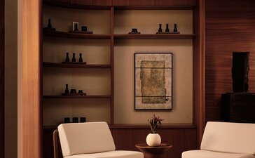 Spa entrance at Amanvari with shelved wooden alcove, seating area and warm lighting.