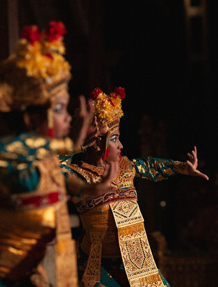 Balinese dancer in traditional costume and headdress performing at Amandari, Ubud.