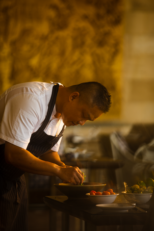 Executive Chef Reza Kurniawan preparing a dish at Amanjiwo, Indonesia.
