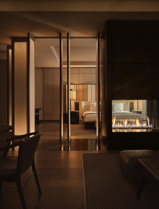Corner Suite at Aman New York with open glass doors and warm ambient lighting.