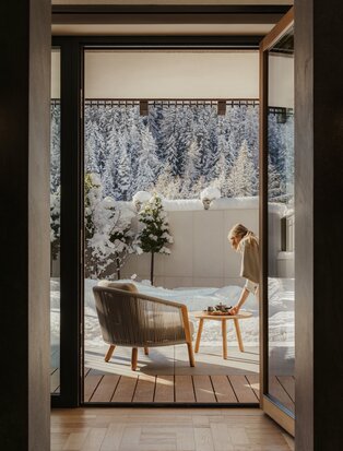 Zen garden room at Aman Rosa Alpina with woodland views and minimalist wooden furnishings.