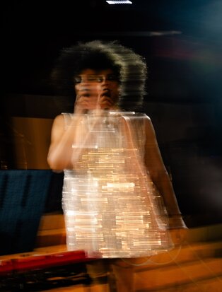 Performer in illuminated costume during festive dinner entertainment at Amanpuri, Thailand.