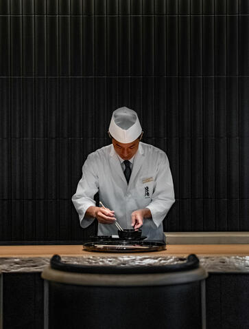 Chef preparing sushi at Taka An dining venue, Aman Kyoto.
