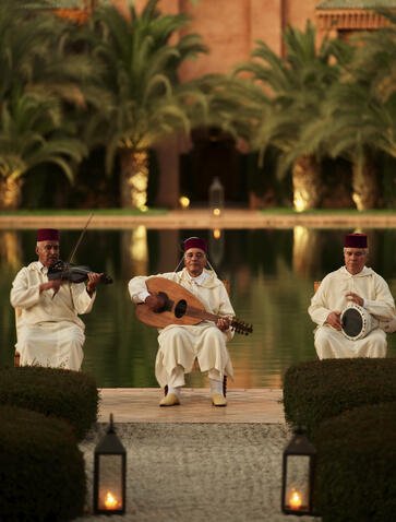 Musicians perform in the courtyard at Amanjena, Morocco, at dusk.