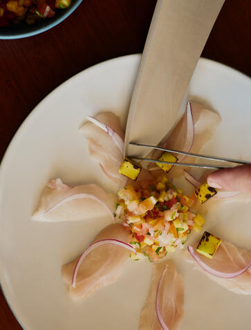 Garlic cloves arranged on a plate at Amanera's foraging and cooking experience.