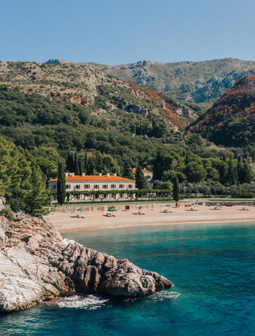 Villa Milocer at Aman Sveti Stefan overlooks turquoise waters and rocky Adriatic coastline, Montenegro.