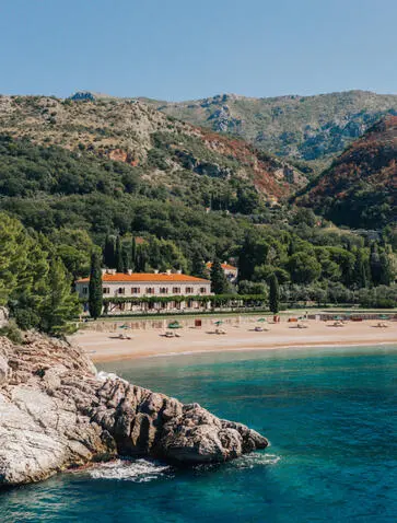 Villa Milocer at Aman Sveti Stefan overlooks turquoise waters and rocky Adriatic coastline, Montenegro.