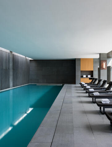 Indoor swimming pool at Amanyangyun with loungers alongside, China.