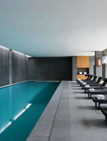 Indoor swimming pool at Amanyangyun with loungers alongside, China.