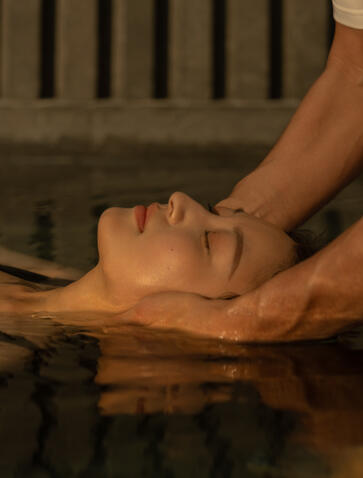 Therapist performing a facial massage treatment at Amanyangyun Shanghai spa and wellness centre.