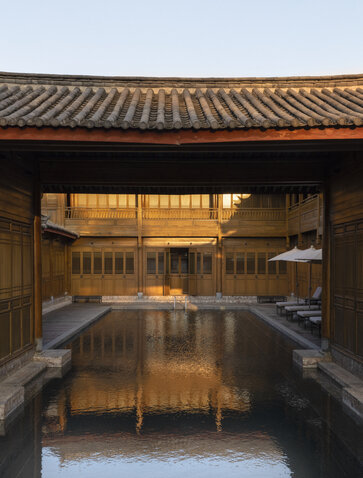 Courtyard with traditional tilework and reflected light at Amandayan.