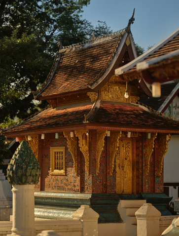 Golden wooden temple pavilion at Wat Xieng Thong, Luang Prabang, featured in Amantaka's temple and city tour.