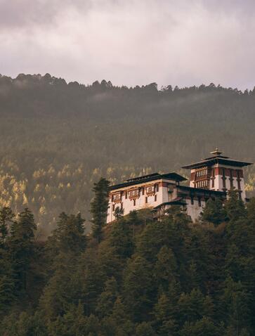 Amankora's architecture perched on a forested hillside in Bumthang valley, Bhutan.