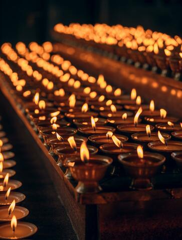 Rows of flickering butter lamps at Amankora, Punakha, Bhutan.
