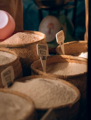 Woven baskets of fresh produce at Thimphu Farmers Market, Amankora, Bhutan.