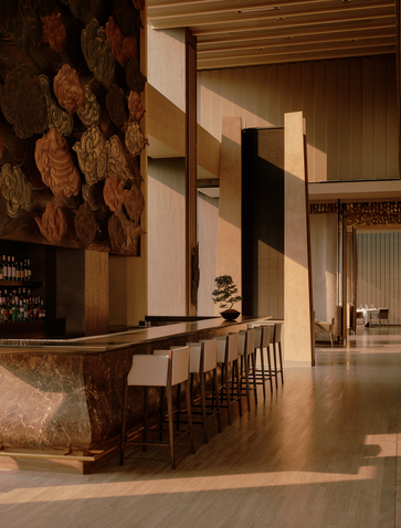 Bar seating area at Aman Nai Lert Bangkok with wooden accents and warm lighting.