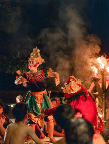 Balinese dancers in traditional dress perform during a ceremonial fire ritual at Amankila.
