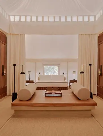 Tented pool pavilion at Aman-i-Khas in India with sunken soaking tub and candlelit ambiance.