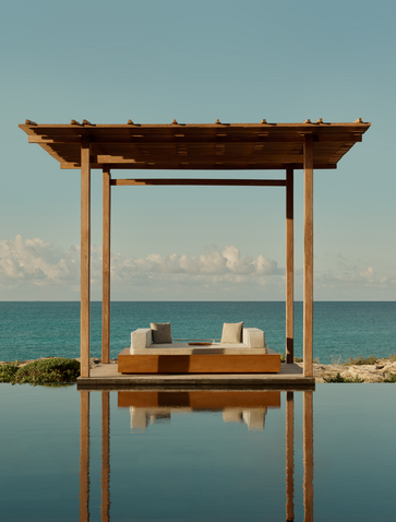 Wooden pergola with two levels overlooking calm turquoise waters at Amanyara, Turks and Caicos.