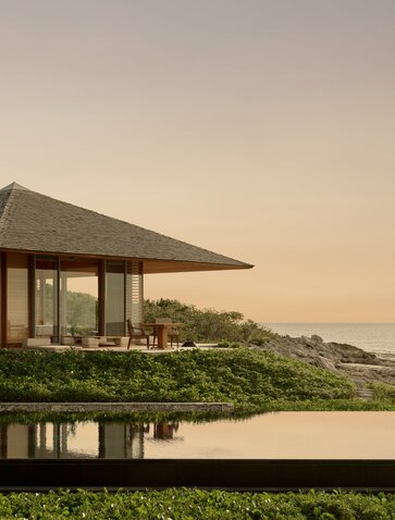 Villa 33 pavilion at Amanyara with expansive views over Turks and Caicos coastline at sunset.